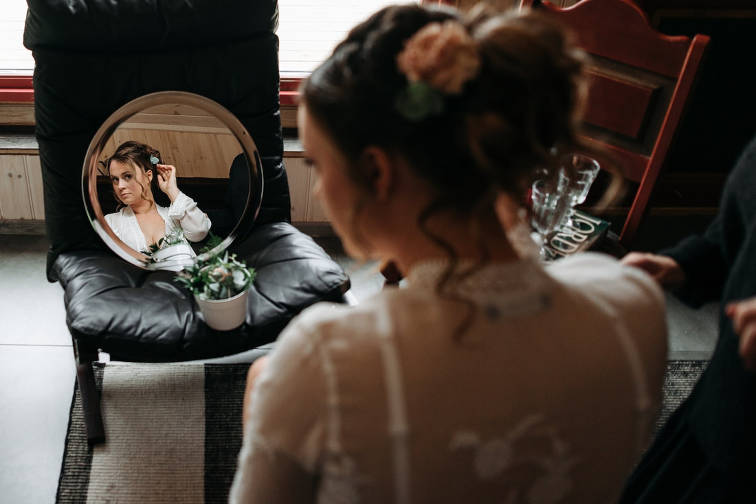 Bride in mirror with chair